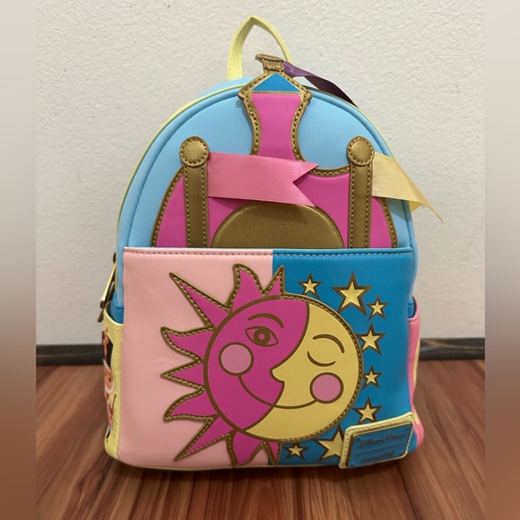 Loungefly Handbags - NWT Loungefly Disney Parks Disneyland Paris it’s a small world backpack